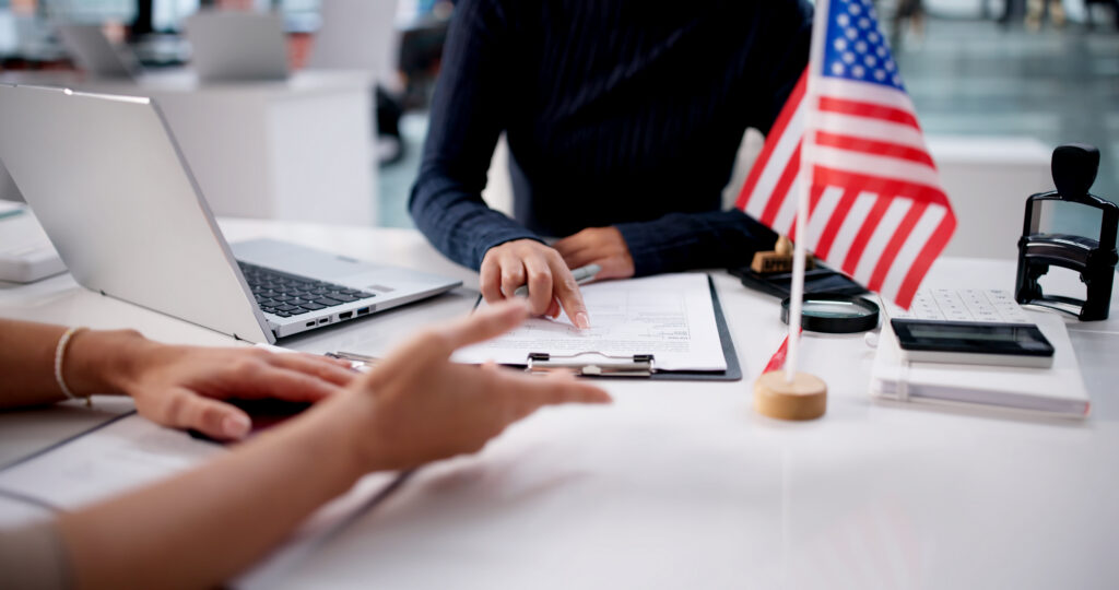 young latina woman reviews her us visa application