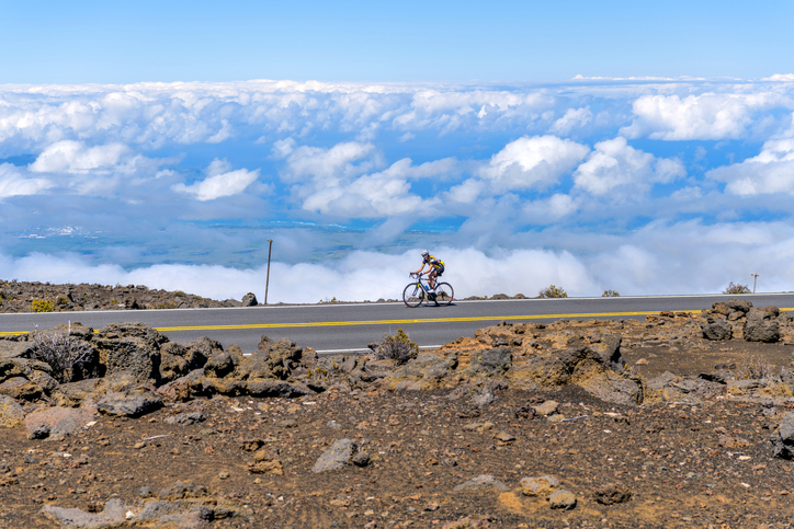 bicyclist riding along a road in Hawaii - Honolulu bicycle accident attorney
