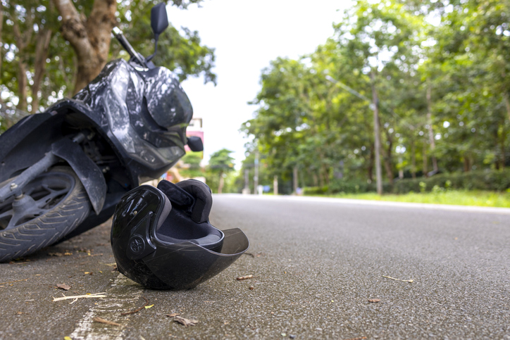 Motorcycle accident scene with helmet - how long does a motorcycle accident lawsuit take?