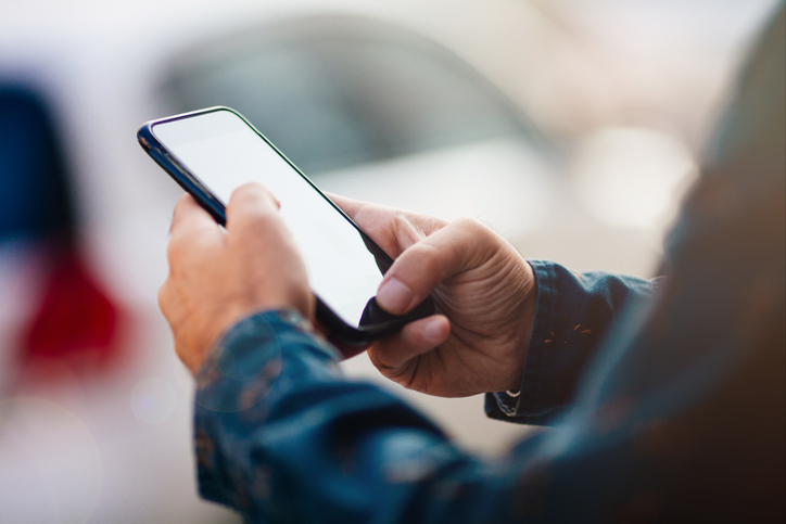 Person using a smart phone - How social media can destroy your personal injury claim: what not to do
