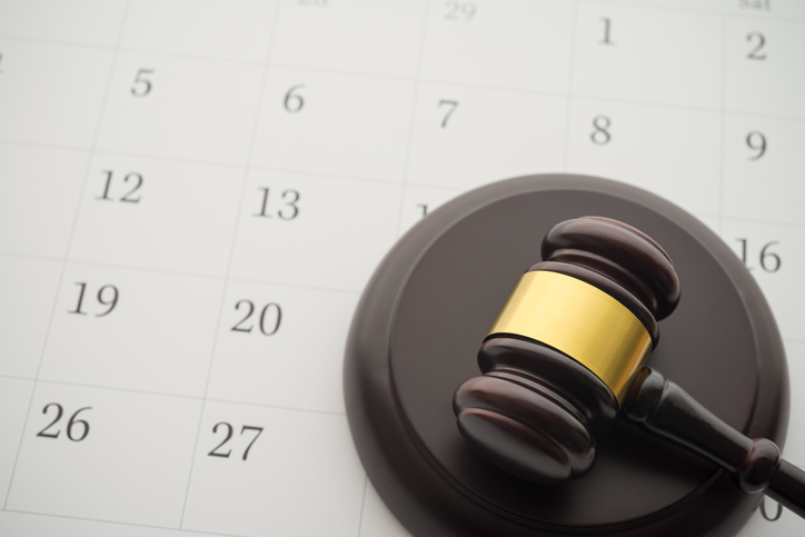 Judge gavel on calendar - hat is a bench warrant?