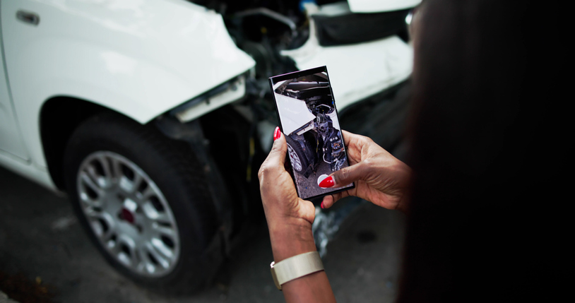 Person taking a picture of a car damaged in a car accident - when does a car accident go to court?