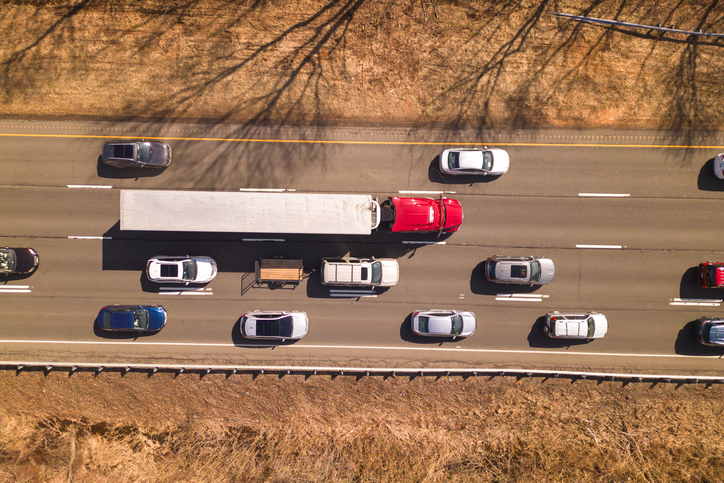 aerial shot of semi trucks in traffic - who pays for medical bills after a truck accident?
